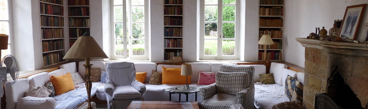 empty living room with a sofa and chairs