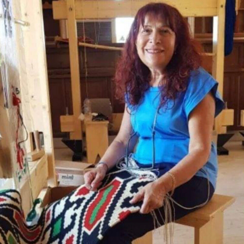 Image of a woman weaving in Geraki