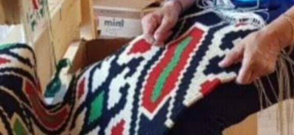 Image of a woman weaving in Geraki