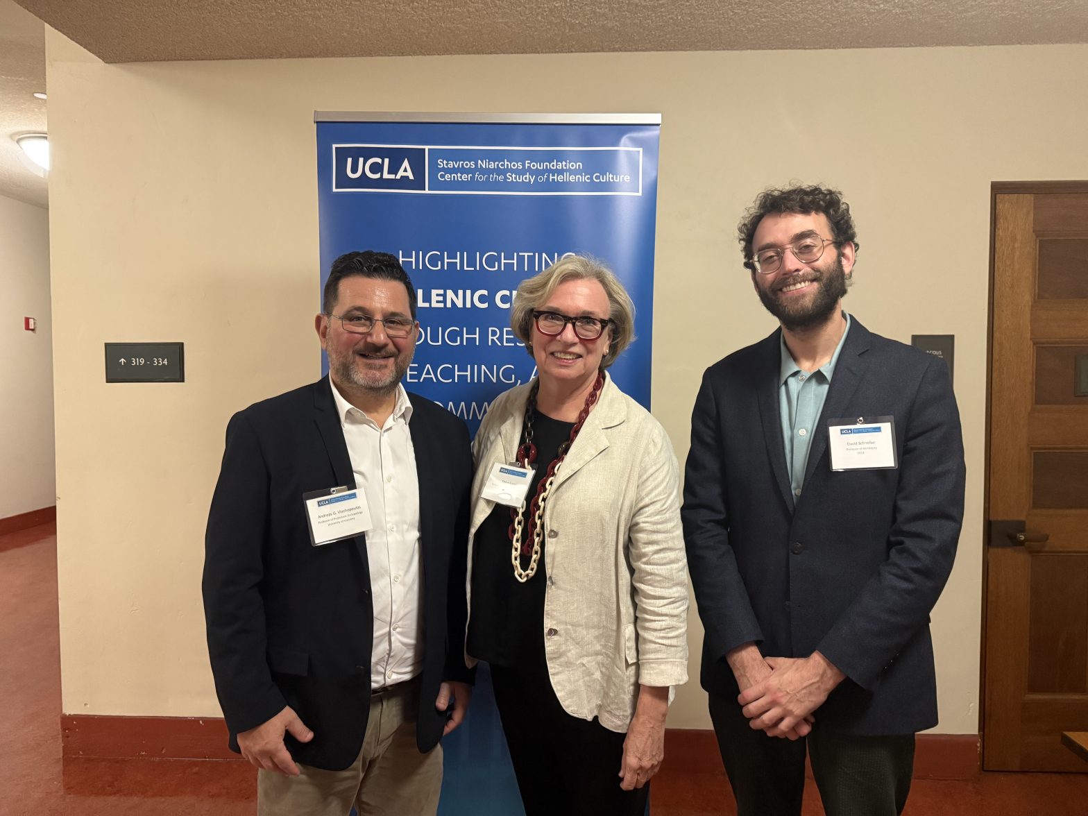 Professor David Schneller and Dr. Claire Lyons stand with Professor Andreas G. Vlachopoulos at lecture on Nov. 22